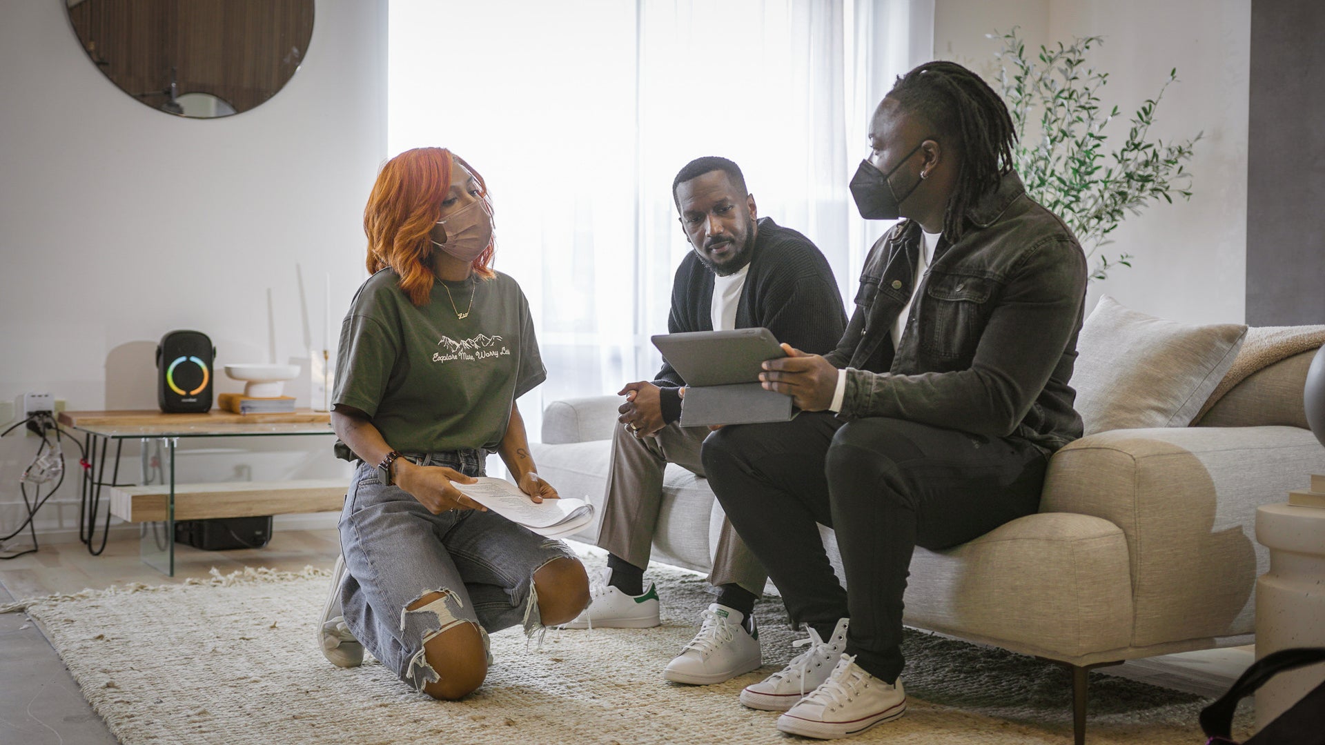 Black creative professionals discussing a client project